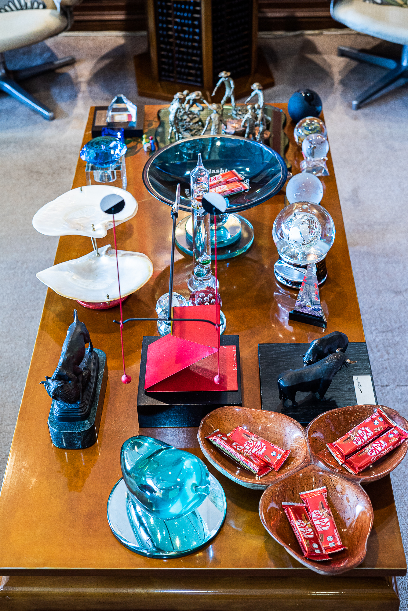 This coffee table held selected small art pieces that he would personally identify. It also help small glass bowls that he would fill with chocolate to offer to his guests. He loved chocolates himself
